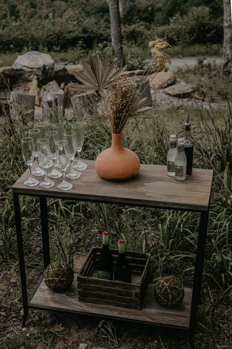  cheers orange pumpkin on brown wooden table  glasses